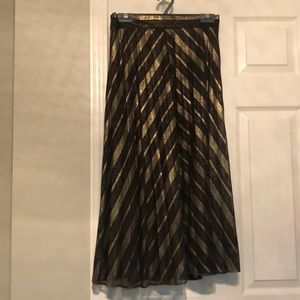 Midi length pleated metallic skirt